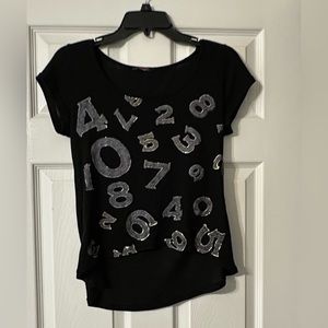 Justice short sleeve shirt is a junior size Small.